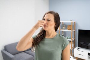 Woman Holding Nose Because Of A Bad Smell