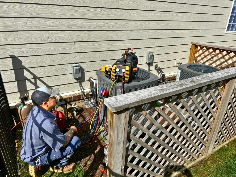 Technician checking ac with tools